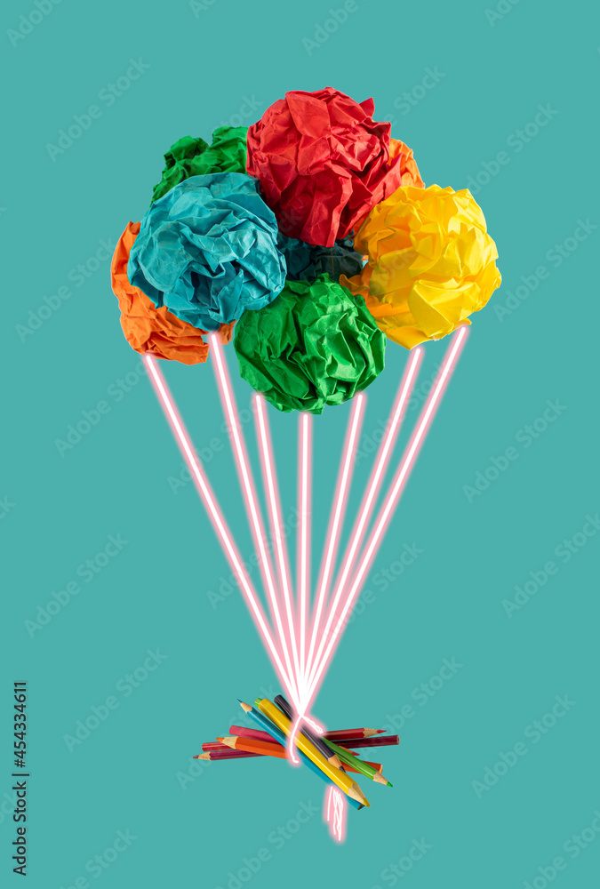 由彩色纸气球、霓虹灯和铅笔组成的创意布置
