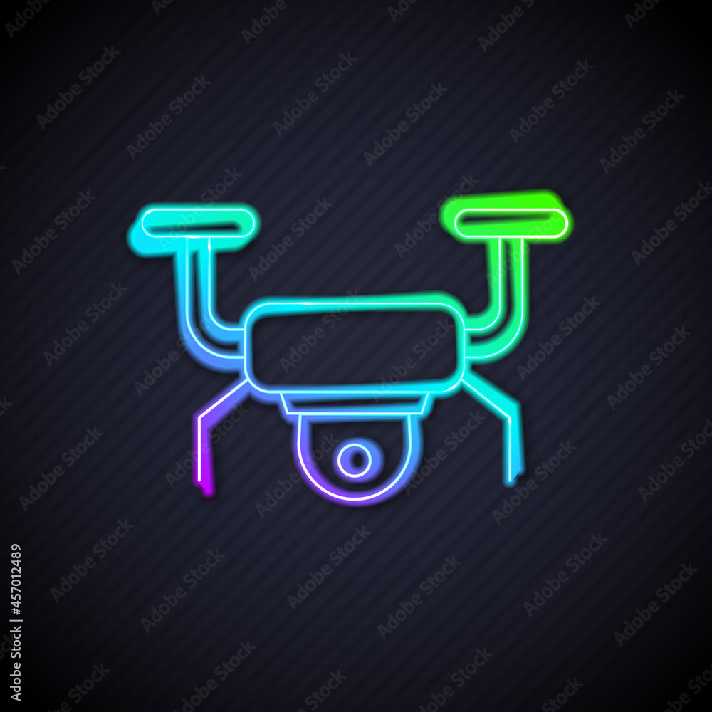 Glowing neon line Drone flying icon isolated on black background. Quadrocopter with video and photo 