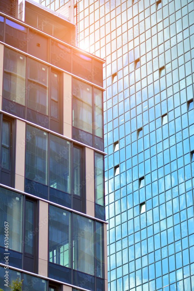 Glass office building in city center on a background close up. Urban architecture of building busine