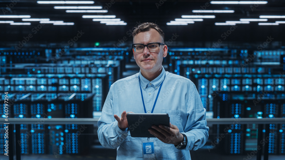 Portrait of a Data Center Engineer Using Laptop Computer. Server Room Specialist Facility with Adult