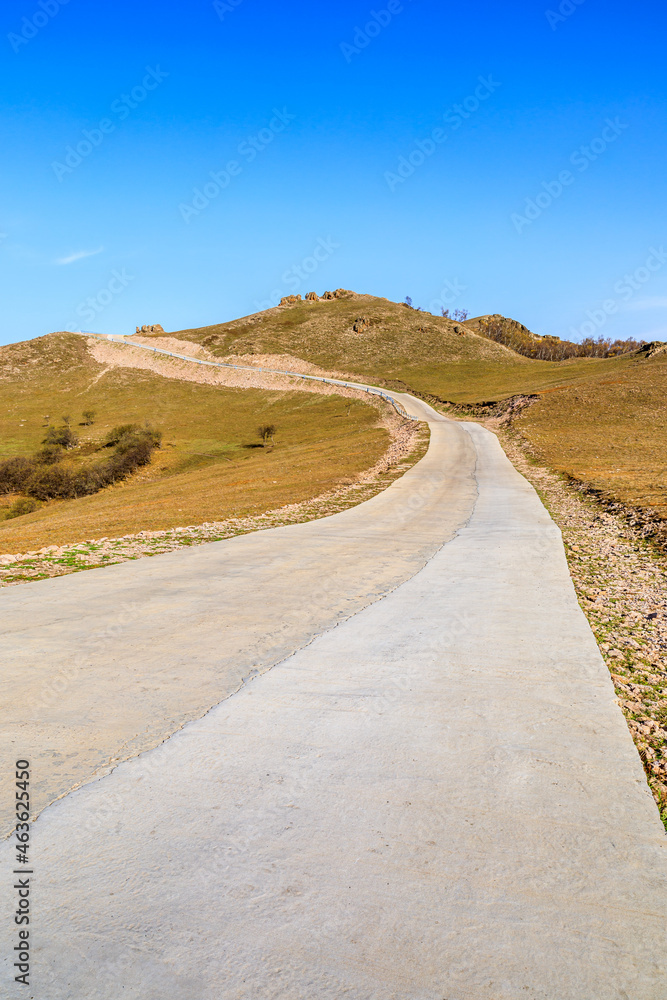 Curved road and mountain natural scenery in autumn season.Road and mountain background.