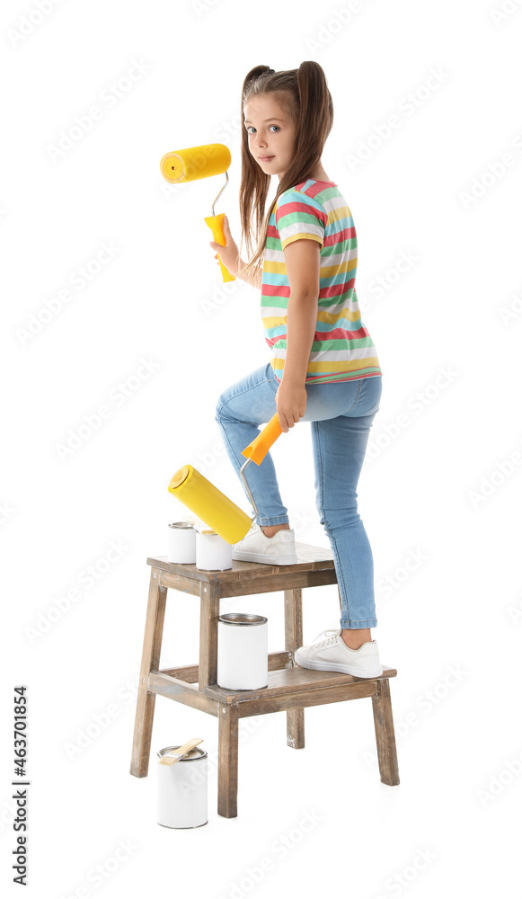 Cute little girl with paint rollers on white background