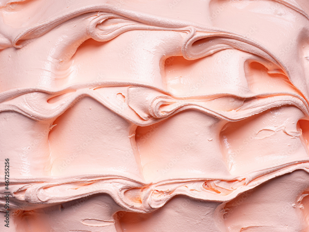 冷冻桃口味冰淇淋-全框架细节。冰的橙色-米色表面纹理特写