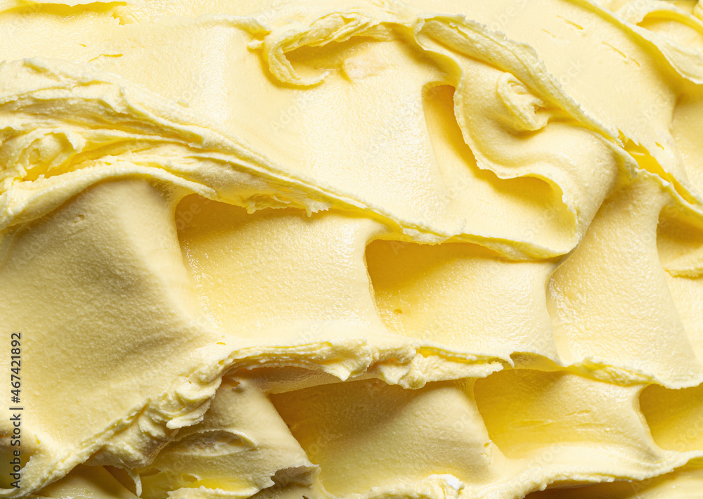 冷冻菠萝味冰淇淋-全框架细节。Ice cre黄色表面纹理特写