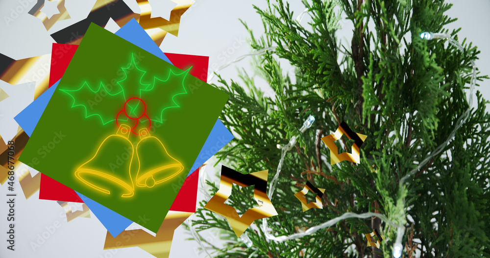 霓虹灯圣诞钟声覆盖圣诞装饰和树枝的图像