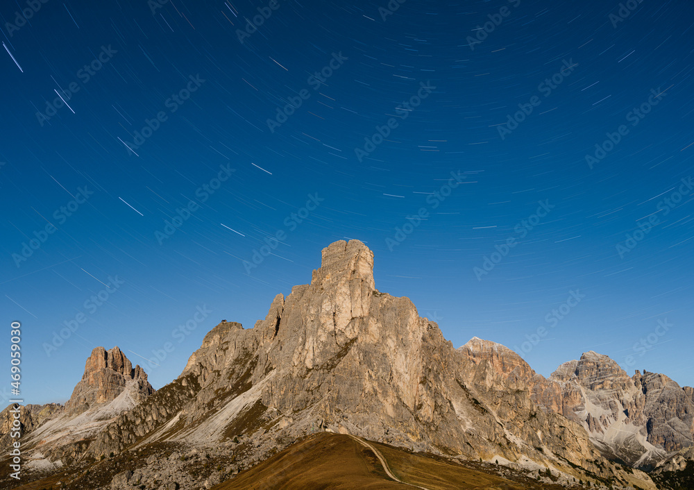 High mountains and stars. Giau Pass, Dolomite Alps, Italy. Landscape in the highlands at the night. 