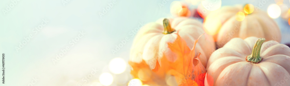 Thanksgiving Day dinner. Holiday served table decorated with pumpkins, autumn pastel colors, leaves 