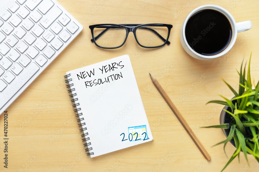 2022 Happy New Year Resolution Goal List and Plans Setting - Business office desk with notebook writ