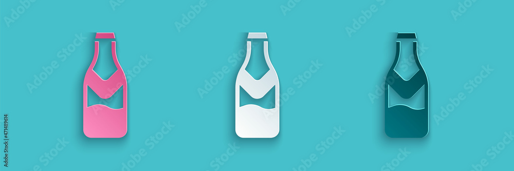 蓝色背景上的剪纸啤酒瓶图标。纸艺风格。矢量