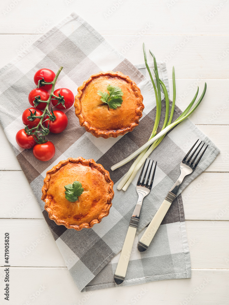 Tasty beef pot pies on table