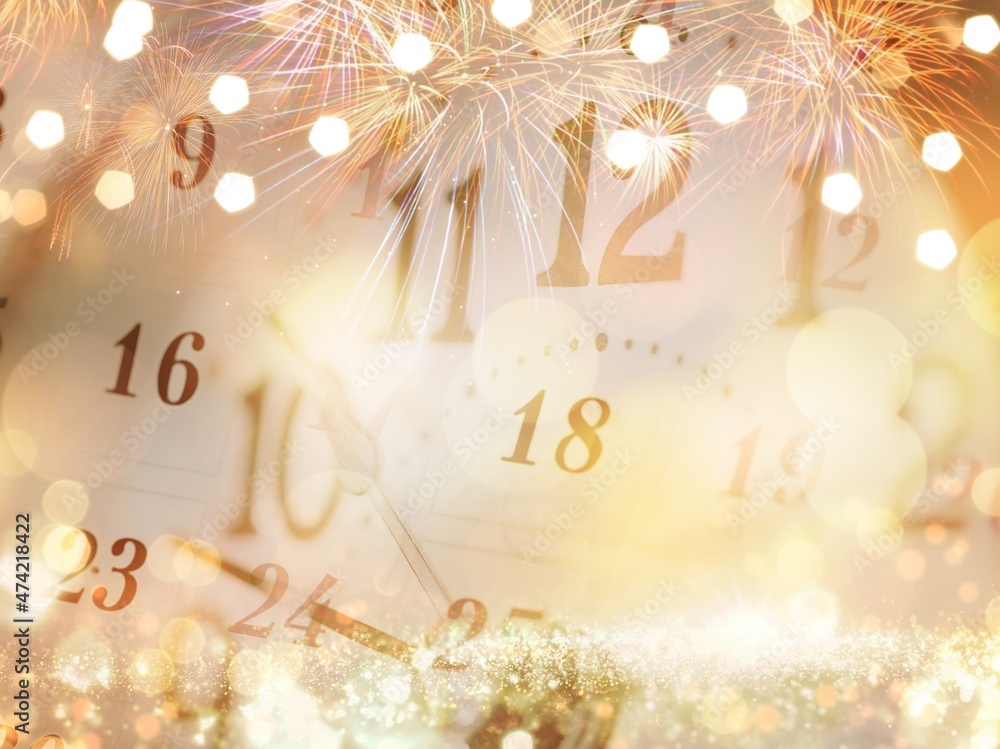 2022 New Year concept with Clock And Fireworks, Golden Abstract Defocused Background