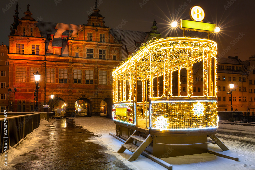 Illuminated tram with Christmas lights on the Green Bridge in Gdańsk. Poland