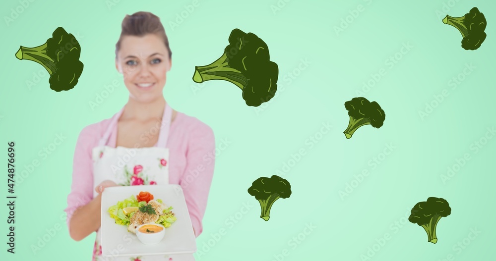 绿底西兰花即食食品的女厨师合成图