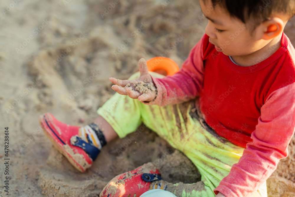 Young children asian sand play outdoor