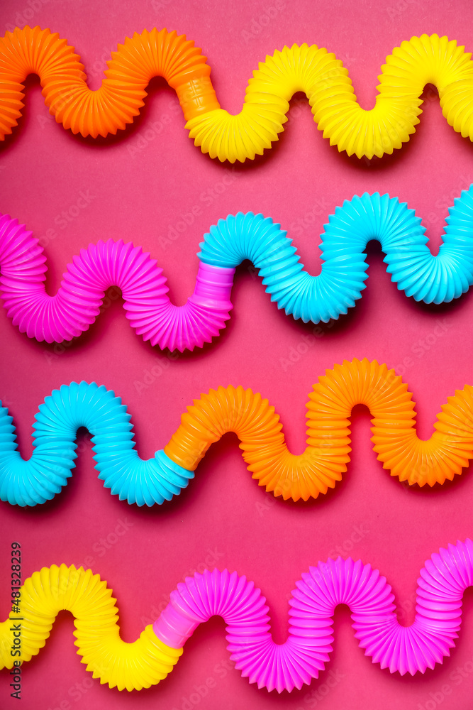 Different Pop Tubes on color background