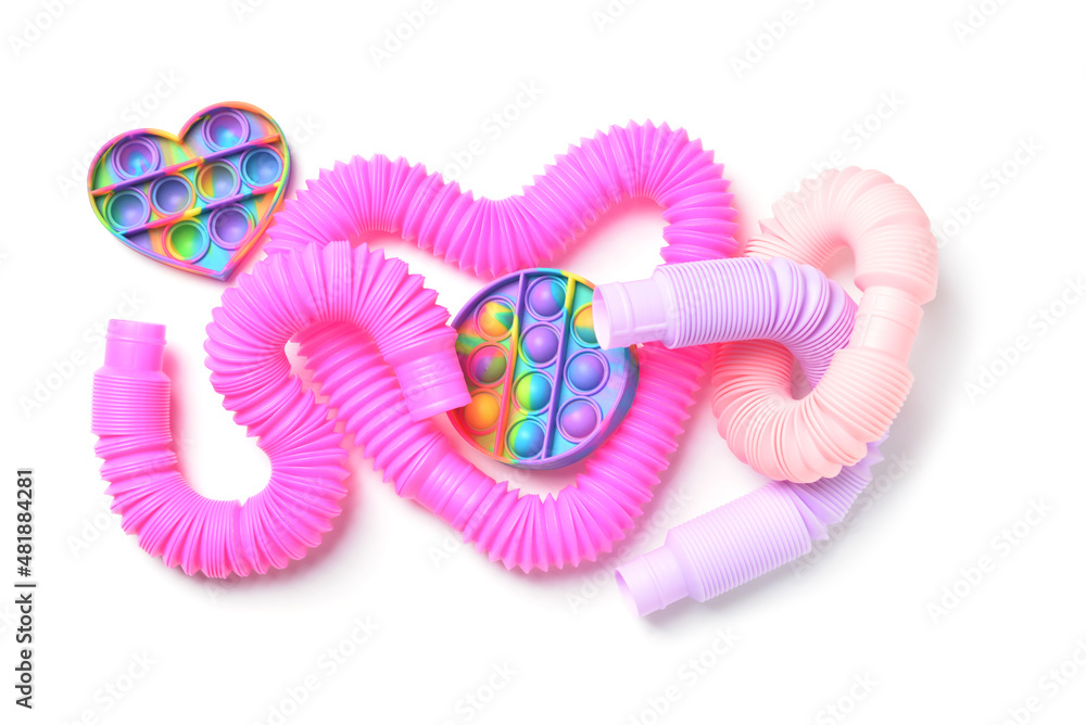 彩色流行管和白色背景上的Pop-it fidget玩具