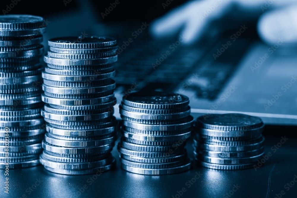 Pile of gold coins stack in finance treasury deposit bank account for saving . Concept of corporate 
