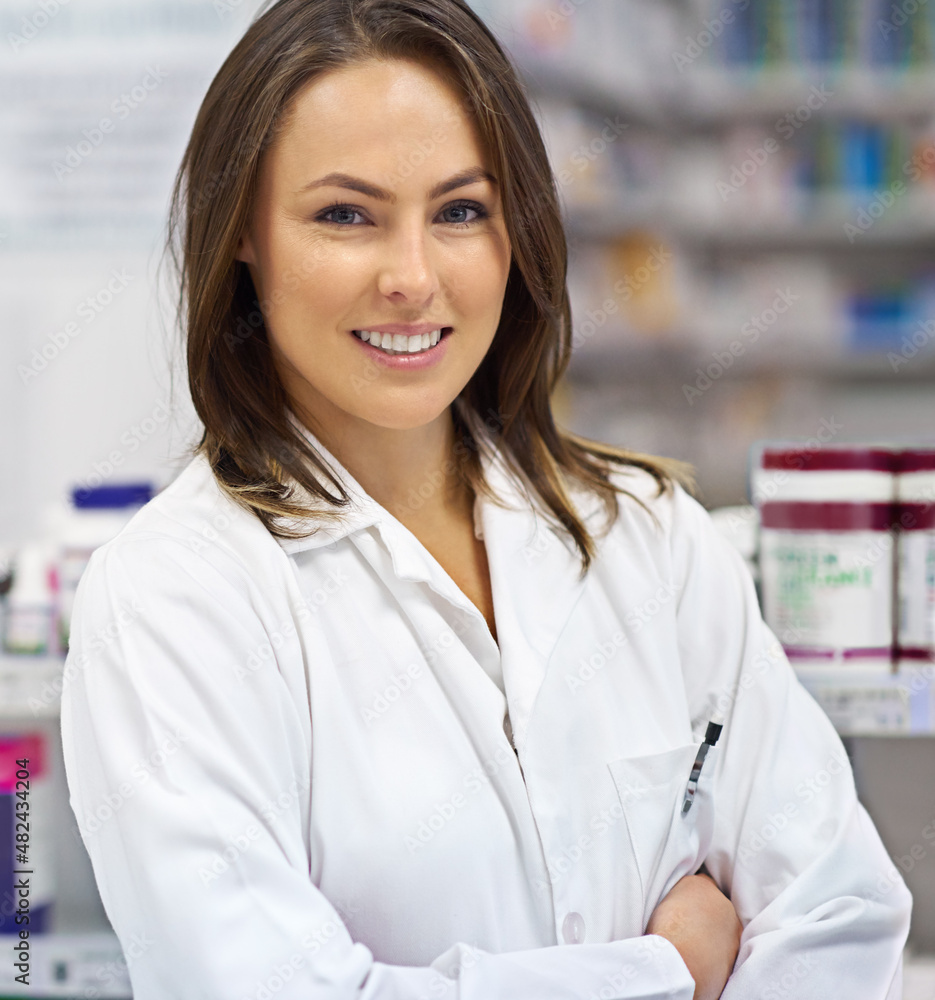 Your friendly local pharmacist. Portrait of an attractive young pharmacist at work.