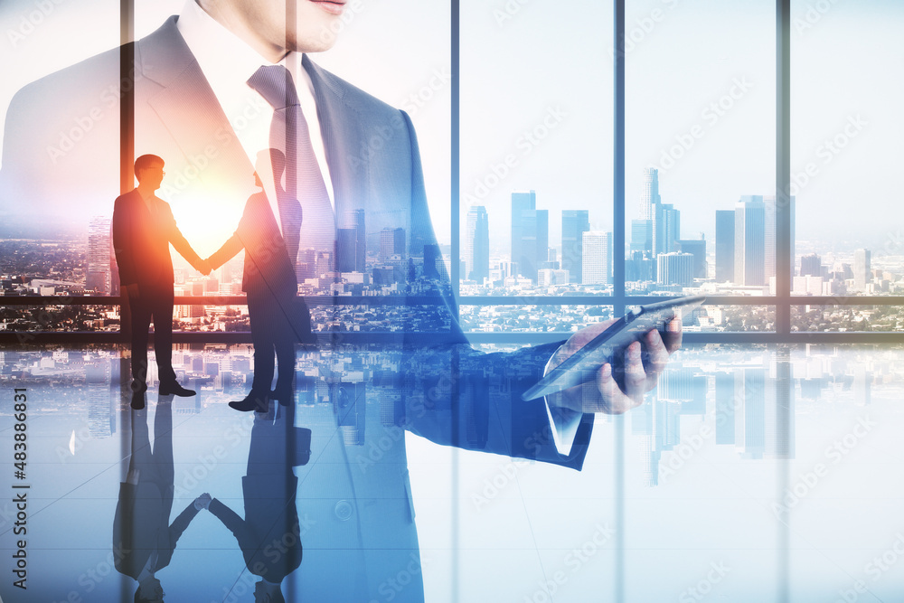 Abstract image of businessman using tablet in modern office interior with panoramic city view, busin