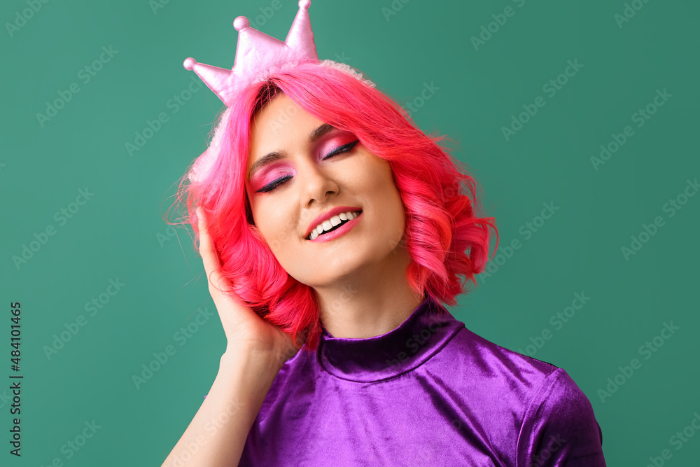 Happy woman with bright hair and crown on color background