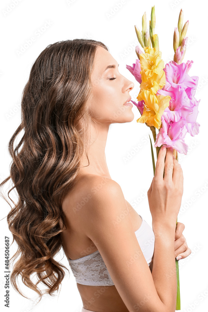 Beautiful woman holding bouquet of Gladiolus flowers on white background