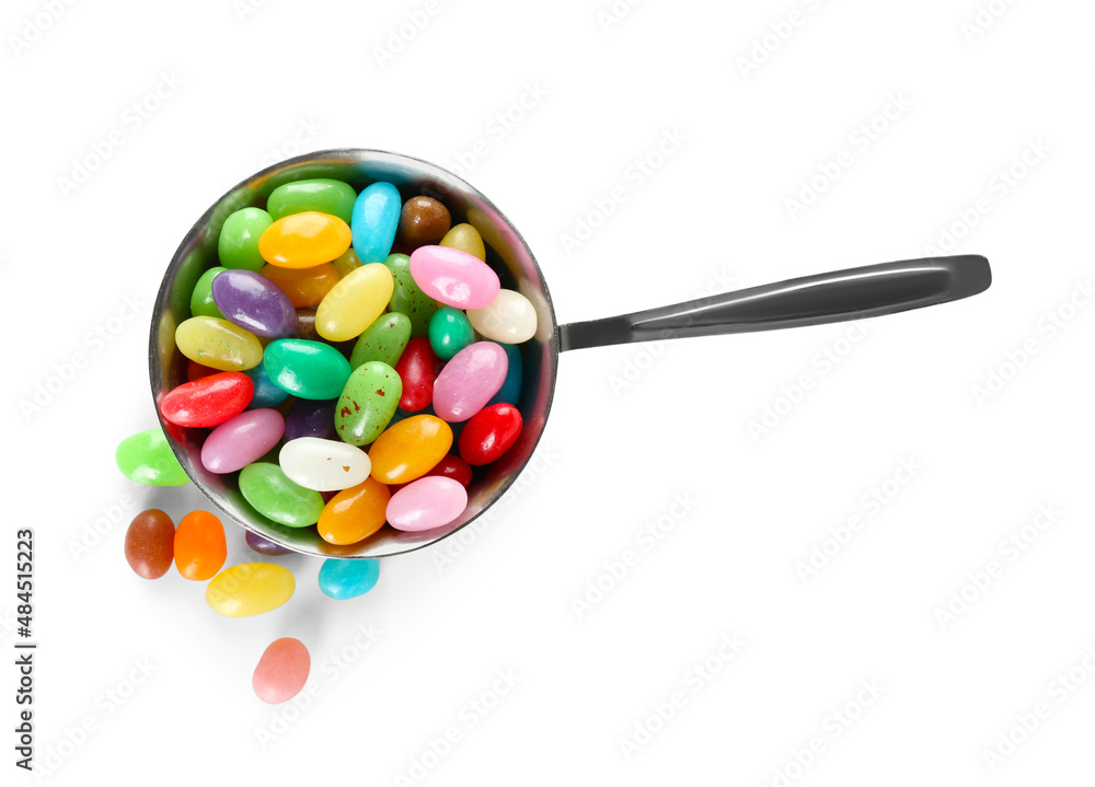 Sauce pan with multicolored jelly beans on white background