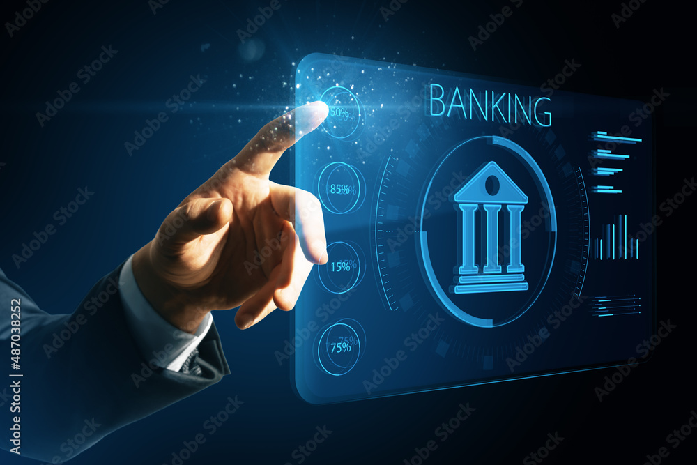 男子用手指着蓝色模糊背景上的创意网上银行全息图。人工智能和自动化c
