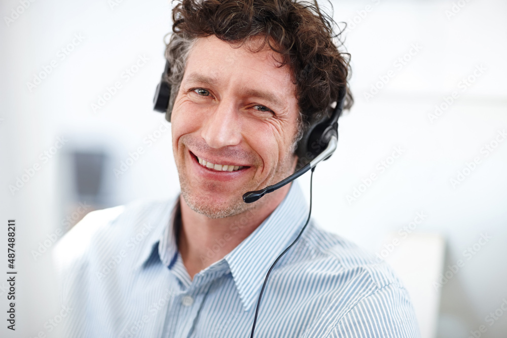 What can I do for you today. Cropped portrait of a handsome call center operator in the office.