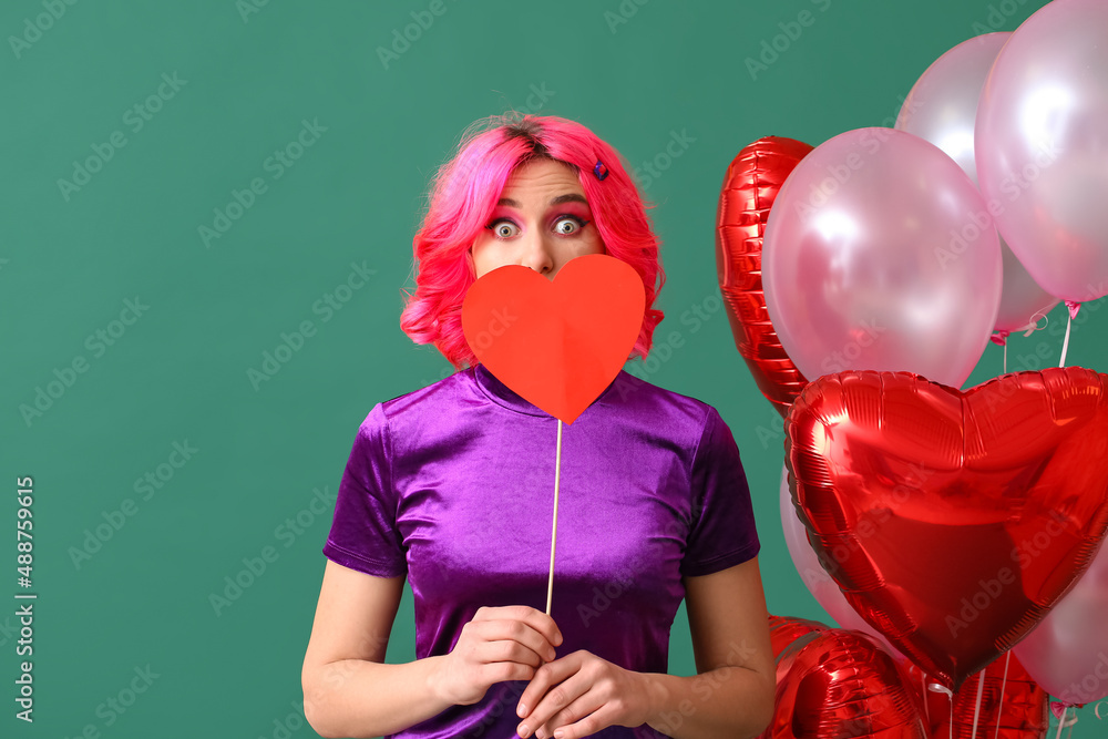 Surprised woman with bright hair, red heart and air balloons on color background. Valentines Day ce