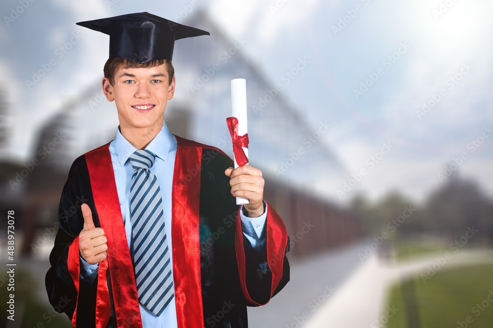 Young Graduation Man Holding Certificate on Background