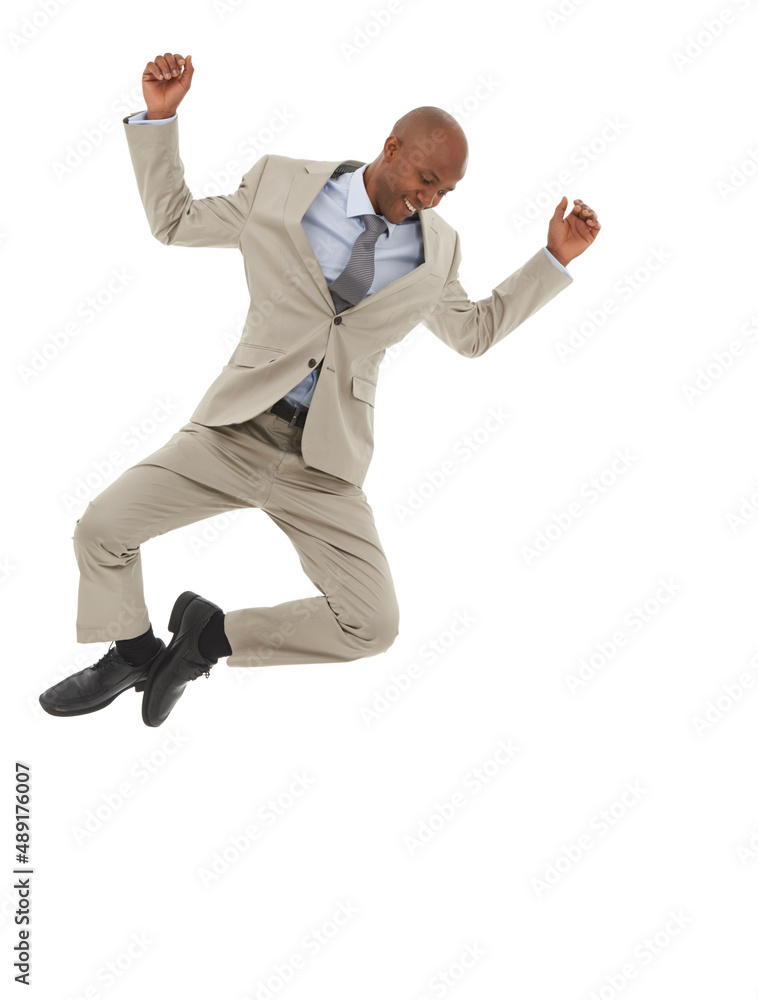 Floating on success. An African-American businessman jumping joyfully in the air.