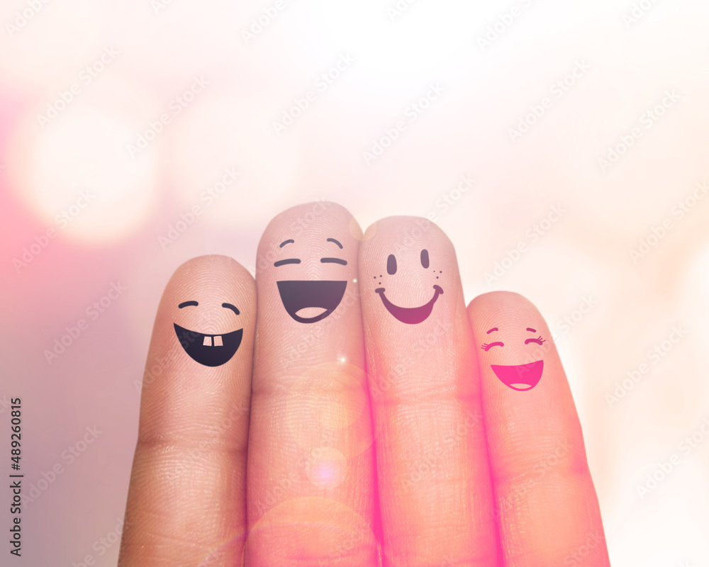 Were a happy family of fingers. Cropped shot of fingers with smileys drawn on them.