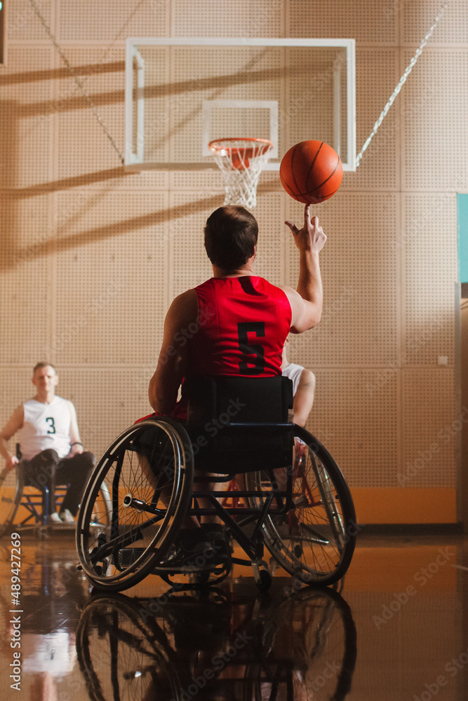 Wheelchair Basketball Play: Player Spinning the Ball on His Finger. Skill of a Winning Person with D