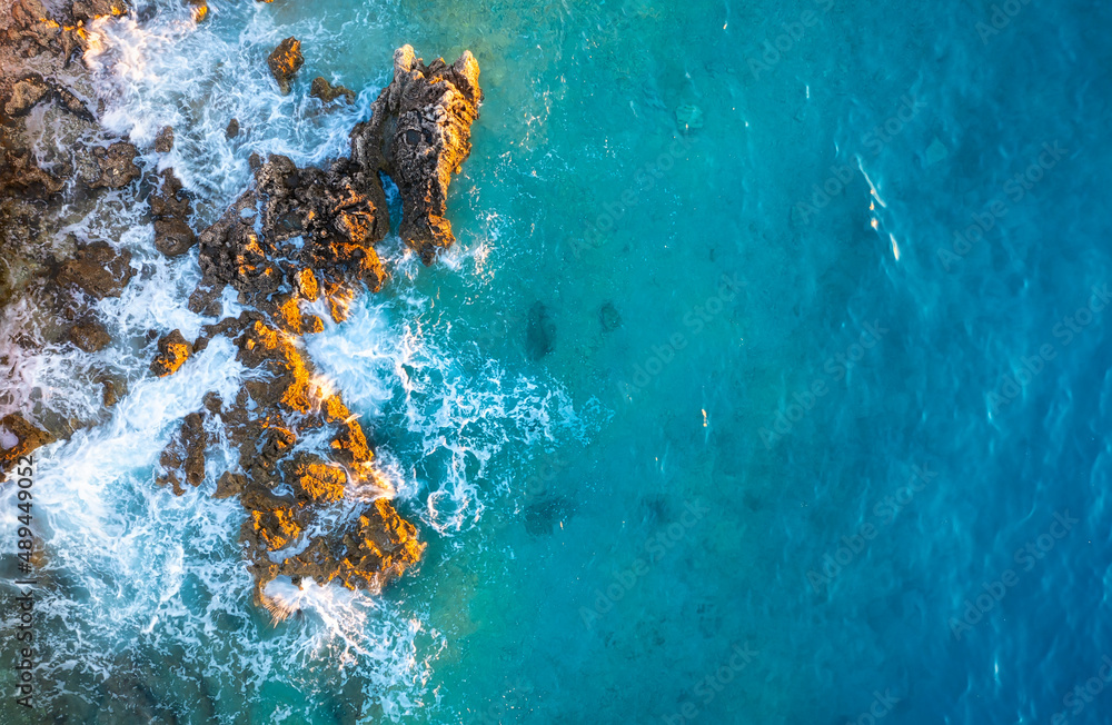 Mediterranean sea. Aerial view on the beach and rocks. Top view from drone at beach and azure sea. T