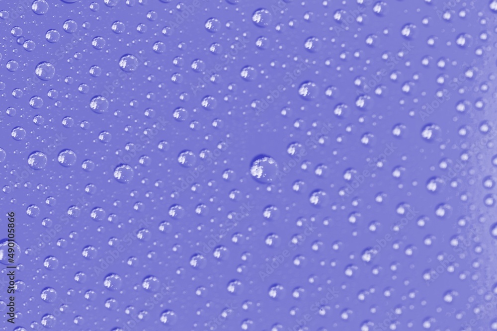 Very peri violet color water drops, abstract background or texture concept.
