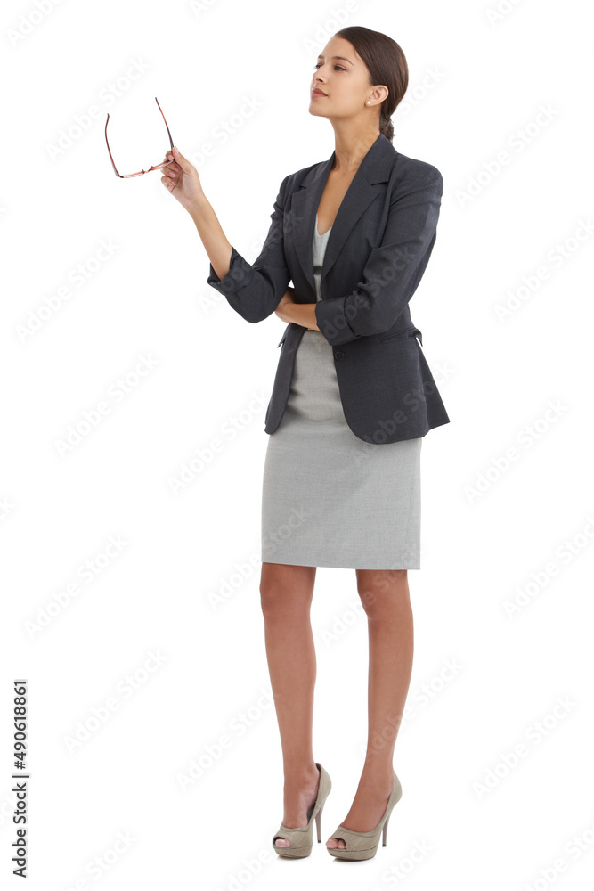 Shes got both feet firmly on the ground in business. Studio shot of a young businesswoman isolated o
