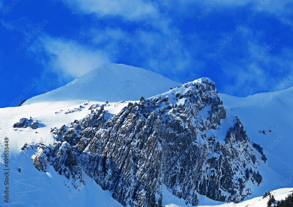 Snow-capped alpine peak Schofwisspitz (1989 m) in Alpstein mountain range and in Appenzell Alps mass