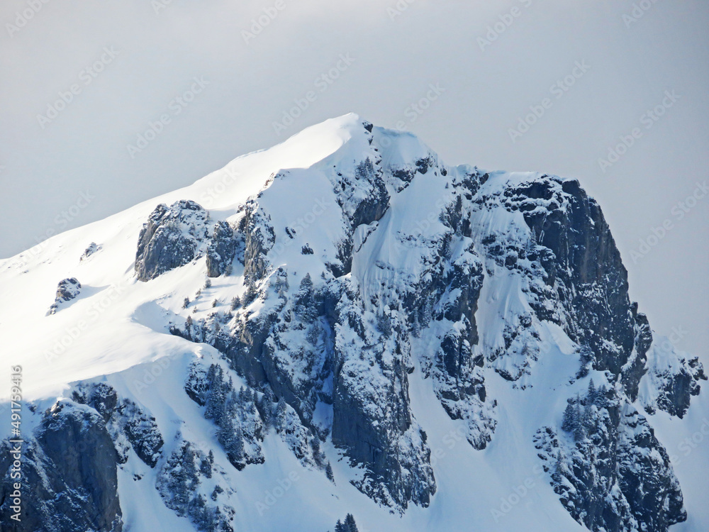 Snow-capped alpine peak Lütispitz (Luetispitz or Lutispitz, 1986 m) in Alpstein mountain range and i