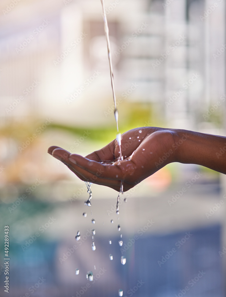 Nothing refreshes like water. Cropped shot of a man washing his hands with refreshing water outdoors