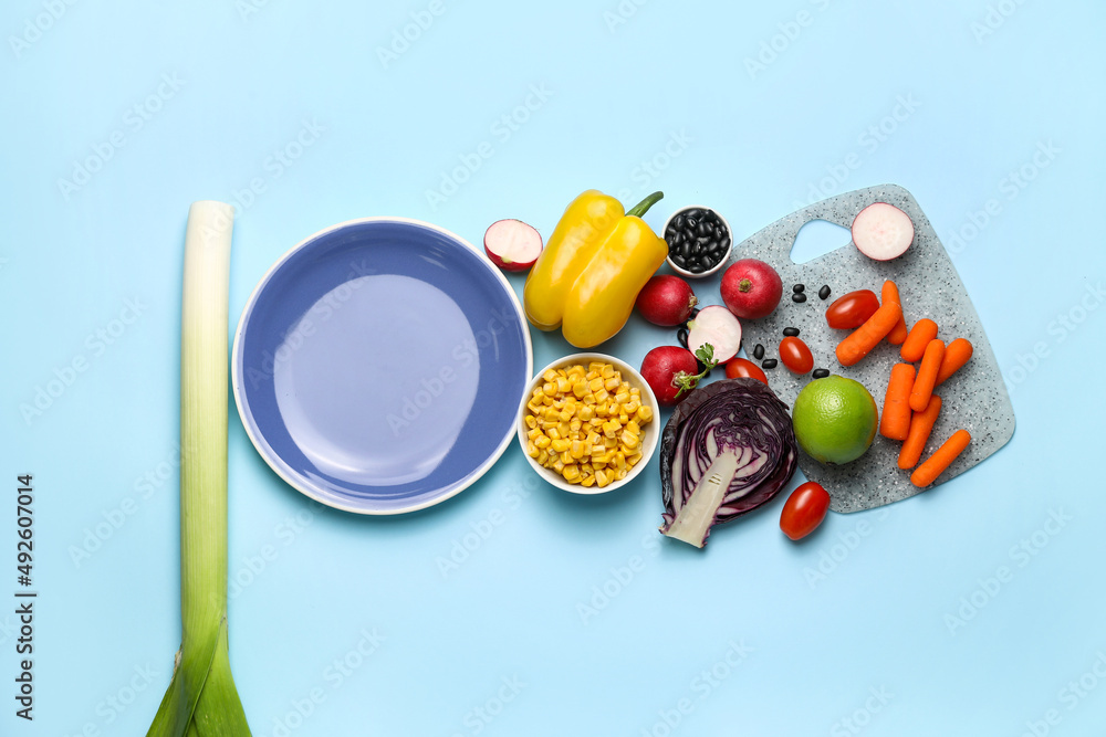 Plate and ingredients for tasty Mexican vegetable salad on color background