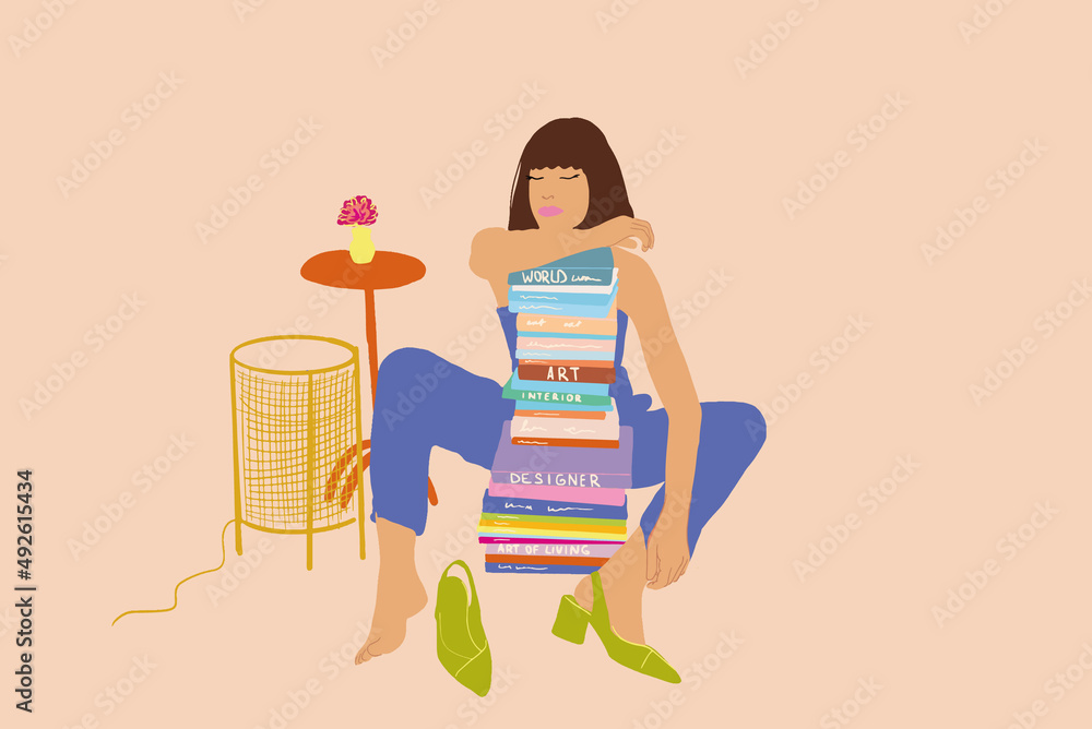 年轻时尚的女人放松地坐在家里，手里拿着一堆书。知识和风格的概念。Ve