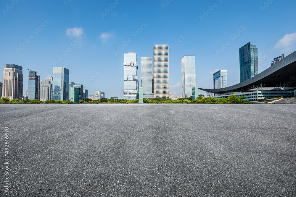 Asphalt road platform and modern commercial buildings in Shenzhen, China.