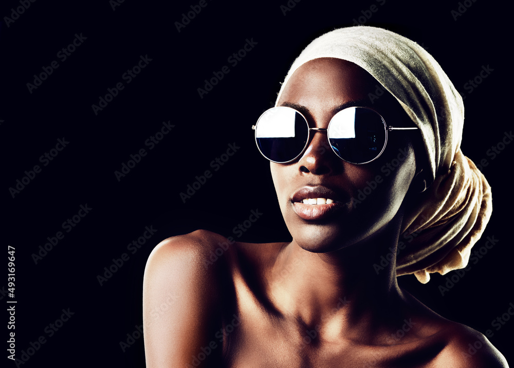 The simplest accessories speak the loudest. Studio shot of a beautiful woman wearing a headscarf aga