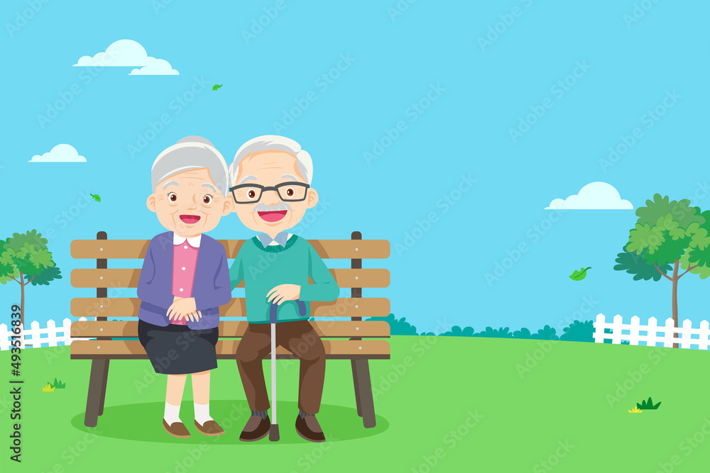 祖父母坐在公园的长椅上