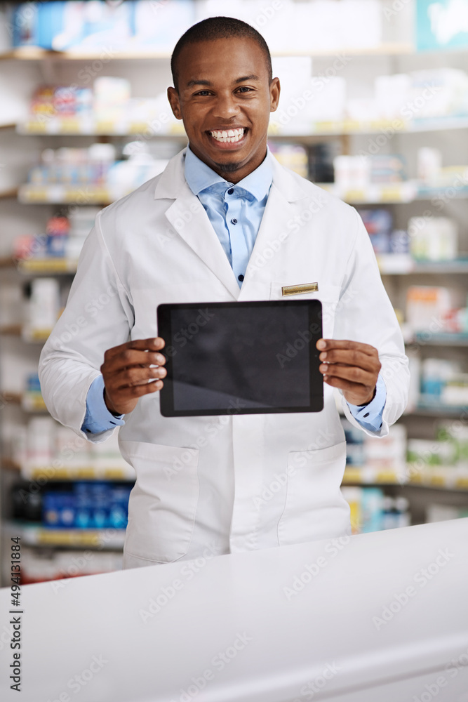 These are our top sellers. Portrait of a young pharmacist holding up a digital tablet with a blank s