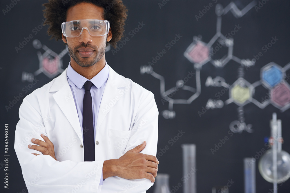 Hes always had an analytical mind. A male scientist standing in front of a blackboard filled with dr