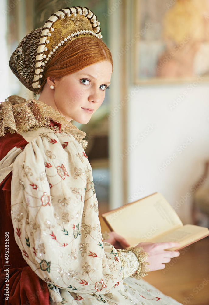 Alone in her chambers. Portrait of an elegant noble woman reading in her palace room.