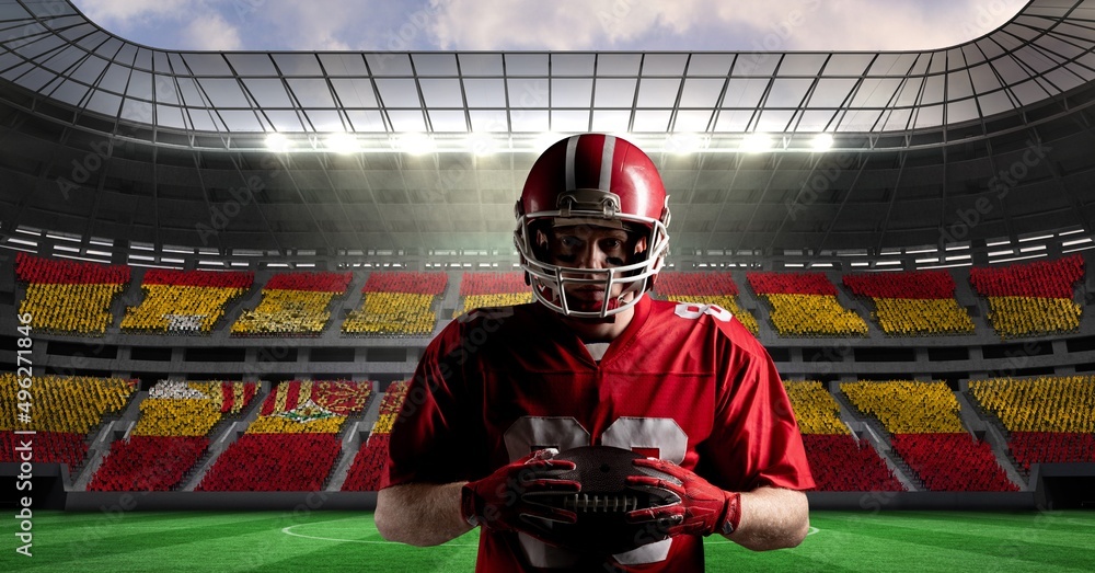 Composite image of caucasian male rugby player holding a rugby ball against sports stadium