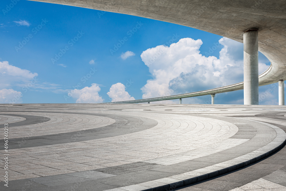 Empty square floor and bridge with sky clouds under blue sky