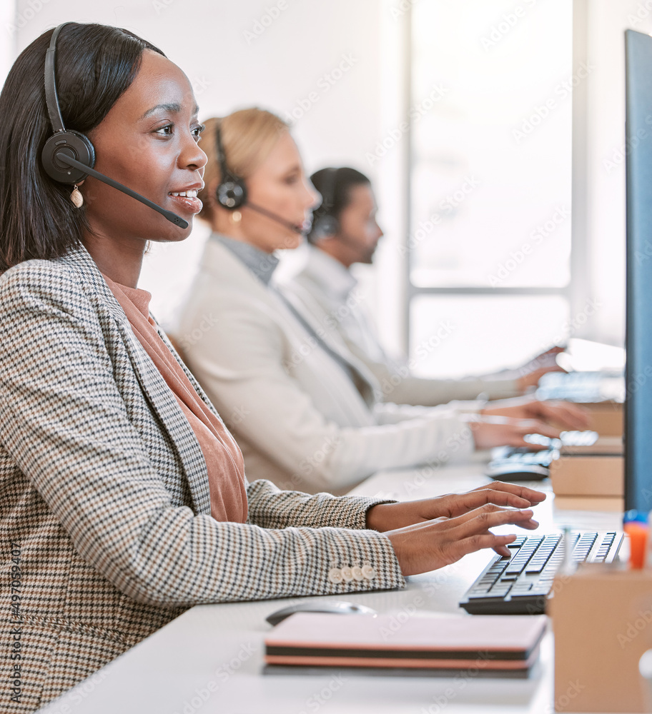 Theyre on call. Cropped shot of an attractive mature female call center agent wearing a headset whil